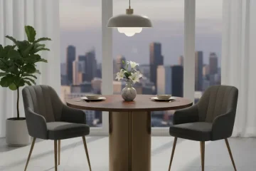 A modern 3 piece dining set featuring a round wooden table with two matching upholstered dining chairs, designed for compact spaces like kitchens or small apartments.