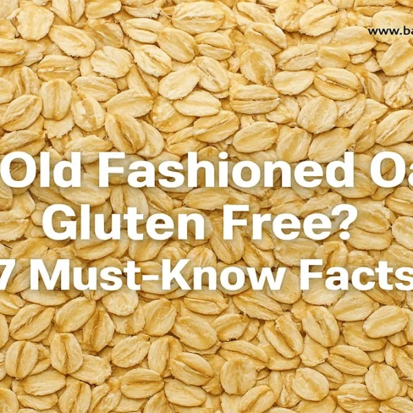 Close-up of dry, golden old fashioned rolled oats, with white text overlay asking: 'Are Old Fashioned Oats Gluten Free? 7 Must-Know Facts.'