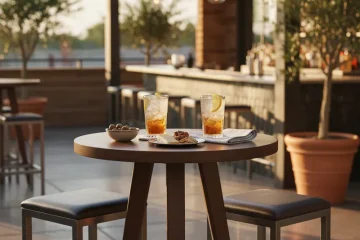 Compact bar height table for 2 with two stools, ideal for small kitchens, apartments, or bistro dining areas.