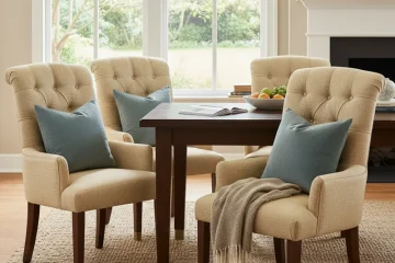 A set of four modern, upholstered dining room chairs with plush cushioning, invitingly arranged around a wooden dining table. The chairs are designed for ultimate comfort and support, enhancing a cozy dining experience.