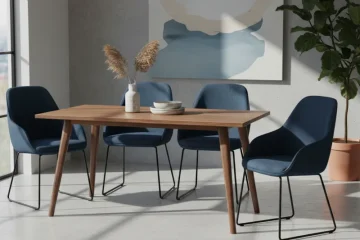 Set of four modern upholstered dining chairs with slender wooden legs, designed for comfort and style in a contemporary dining room setting.