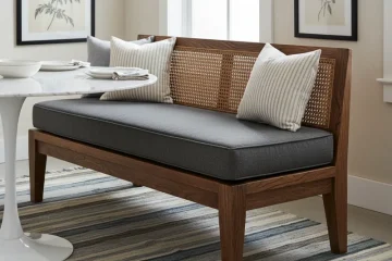 Stylish dining room bench chair with an upholstered seat and backrest, positioned at a wooden dining table. This comfortable and space-saving seating solution is perfect for modern or farmhouse dining areas, maximizing capacity for family meals and entertaining.