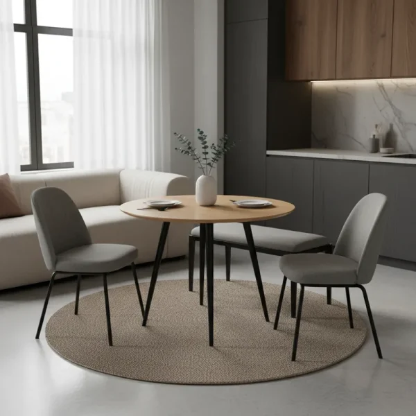 A modern compact dining set for a studio apartment, featuring a small rectangular table and two chairs in a minimalist living space.