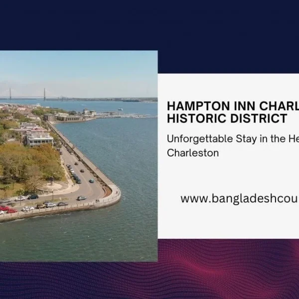 Aerial view of Charleston Historic District waterfront with historic buildings, a park, coastal road, and a distant suspension bridge, promoting Hampton Inn Charleston Historic District.
