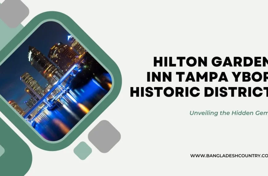 Promotional graphic for Hilton Garden Inn Tampa Ybor Historic District. Features the hotel's name in bold black text, the tagline 'Unveiling the Hidden Gems' in green italics, and a vibrant night city skyline with illuminated skyscrapers reflecting on water, all set against a modern green and white background.