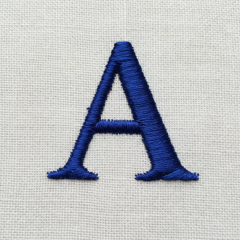 A close-up shot of a neatly hand-embroidered monogram