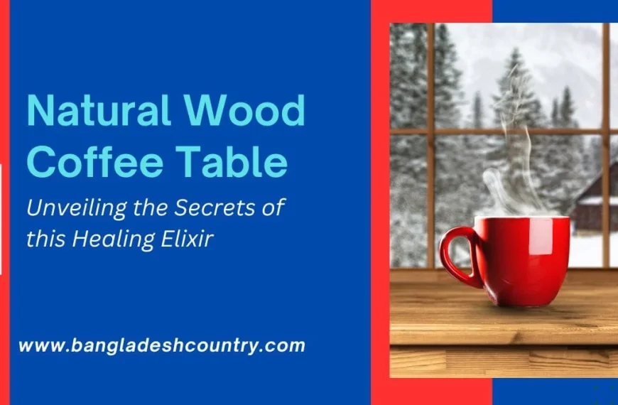 A steaming red coffee mug rests on a natural wood table, looking out onto a snowy winter landscape with pine trees and a distant cabin through a window. The image also displays text: 'Natural Wood Coffee Table', 'Unveiling the Secrets of this Healing Elixir', and 'www.bangladeshcountry.com'.