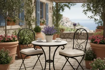 Small round wooden table with two matching chairs, ideal for compact dining spaces, kitchen nooks, or balconies.