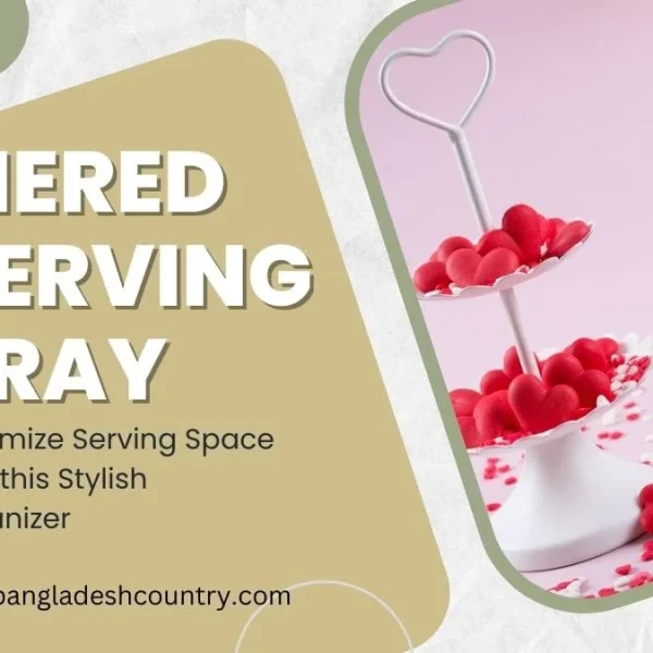 A white two-tiered serving tray featuring a heart-shaped handle, filled with red heart-shaped candies, on a pink background with scattered sprinkles. The image promotes a stylish organizer to maximize serving space.