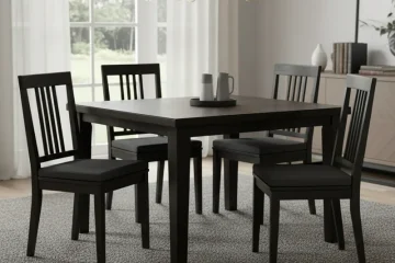Sleek wood black dining chairs with a modern design, perfect for a contemporary dining room. Features dark wooden frames and minimalist aesthetics.