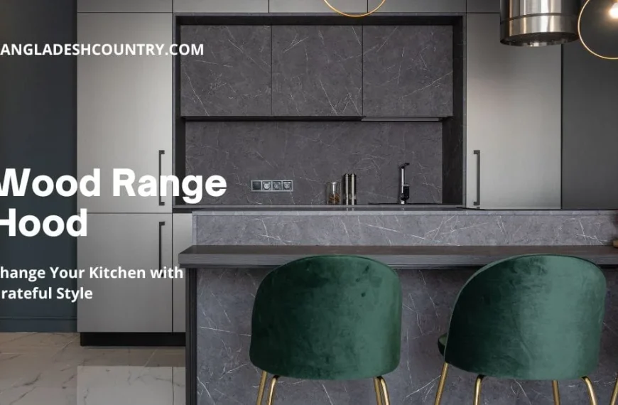 Modern kitchen interior featuring dark grey marble-patterned cabinets, a matching backsplash, and light grey integrated appliances. A dark kitchen island with a wood-look counter is paired with three emerald green velvet bar stools with gold legs. On the island, a vase of vibrant red flowers sits on a gold tray. A stainless steel range hood and two contemporary pendant lights hang overhead. Overlay text reads: 'Wood Range Hood', 'Change Your Kitchen with Grateful Style', and 'BANGLADESHCOUNTRY.COM'.