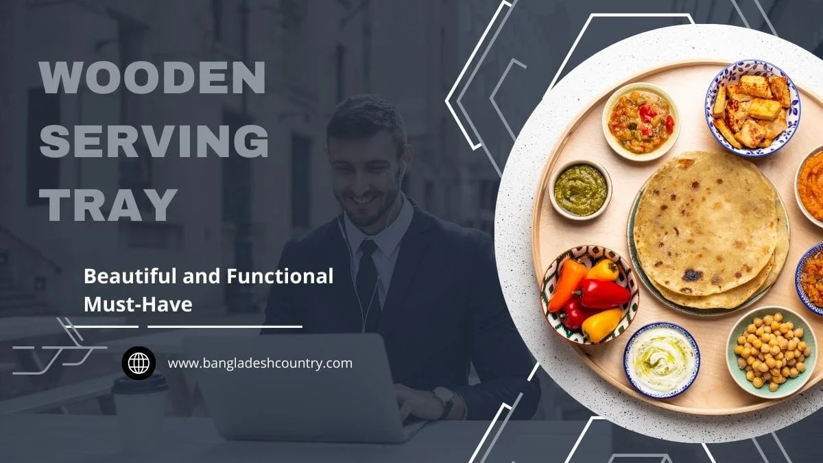 A round wooden serving tray displaying a variety of colorful South Asian dishes, including flatbreads, curries, and dips. The image features a smiling man working on a laptop in the blurred background and prominent text 'WOODEN SERVING TRAY' and 'Beautiful and Functional Must-Have'.